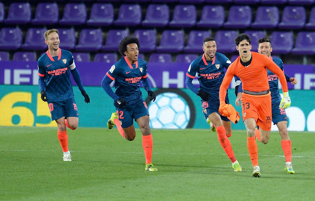 Sevilla players celebrating with Bono after the goal keeper scored a goal in injury time to force a draw against Real Valladolid