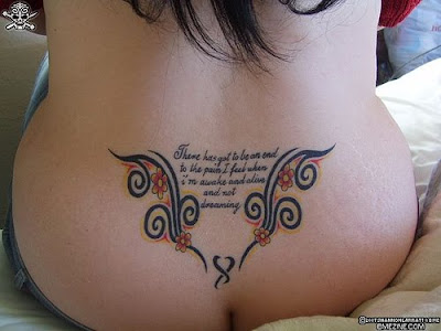 girls lower back tattoos with scroll tattoos tribal designs