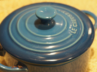 A small blue lidded crock.