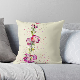 Cushion/pillow with pink watercolour hollyhocks on a cream background