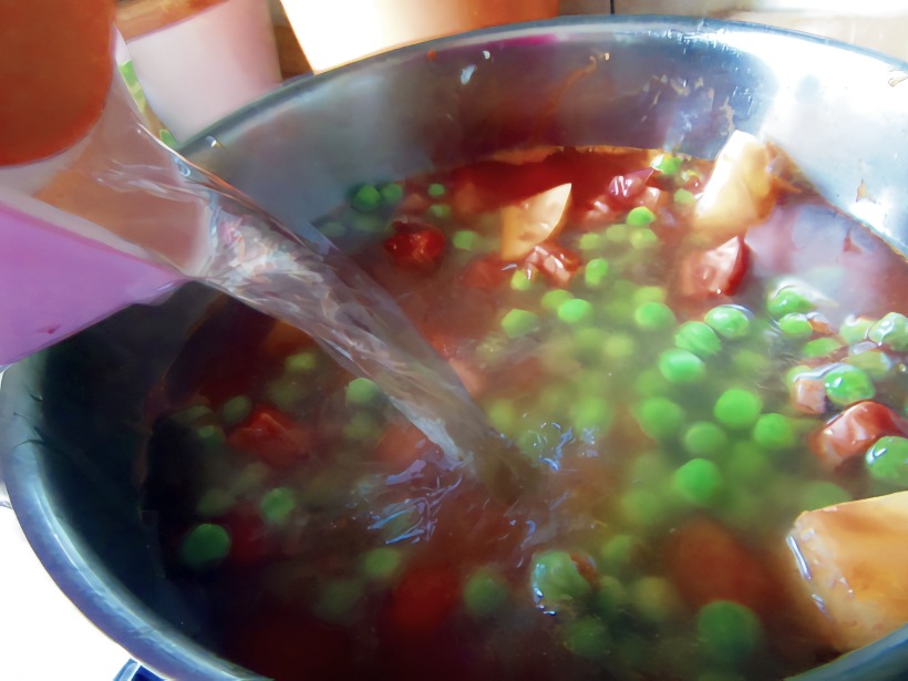 Add peas, tomato puree, water, salt and pepper