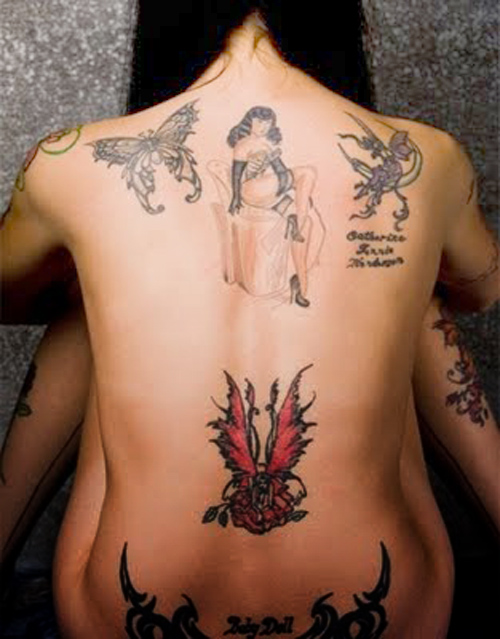 butterfly back tattoos for girls. utterfly tattoo, lower ack.