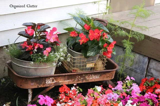 Photo of a junky garden planter vignette.