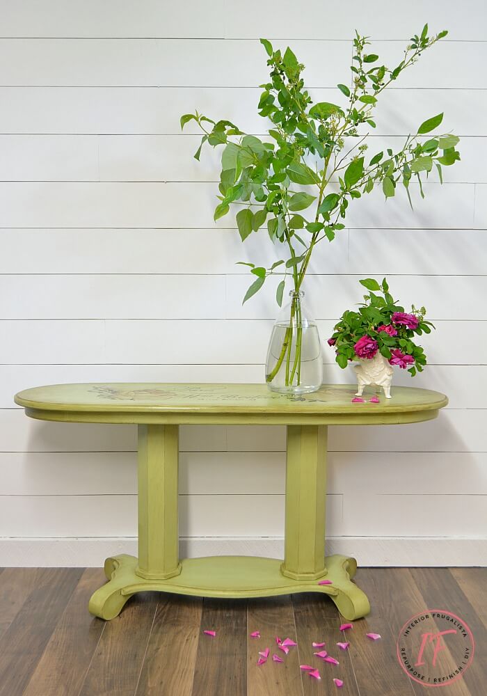 A long oval golden oak empire style console table makeover with French Country Charm with a gorgeous Chatellerault furniture transfer and green paint.