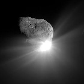 Photograph of comet Tempel-1 taken by the Deep Impact flyby spacecraft, 67 seconds after the impactor made contact with the surface.