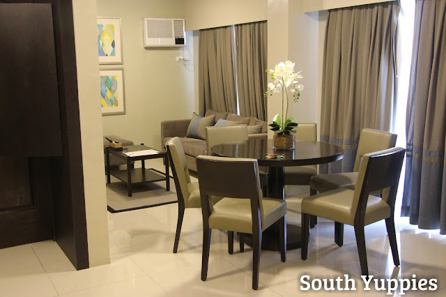 Dining area and living room of Bellini Suites