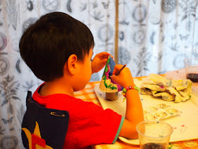 Boy painting 3D Christmas trees