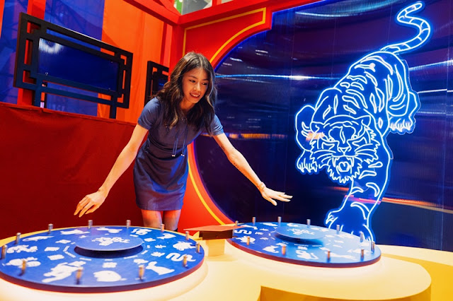A guest trying their hand at the Boldest Spin at Sunway Velocity Mall KL