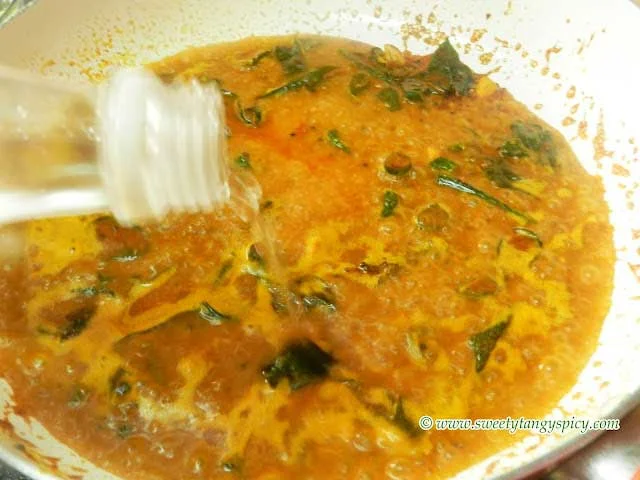 Pouring Vinegar into Boiling Curry Base for Naranga Curry