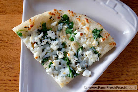 image of a slice of copycat CPK white spinach pizza on a plate