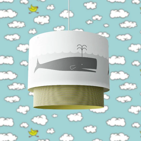 pendant light with a whale motif on the paper drum shade