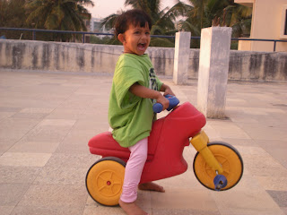 baby girl with bicycle