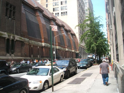 Line of people waiting to storm the armory