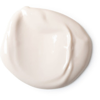 A circle of thick white cream on a bright background