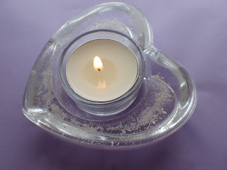 Resin heart shaped candle holder containing ashes