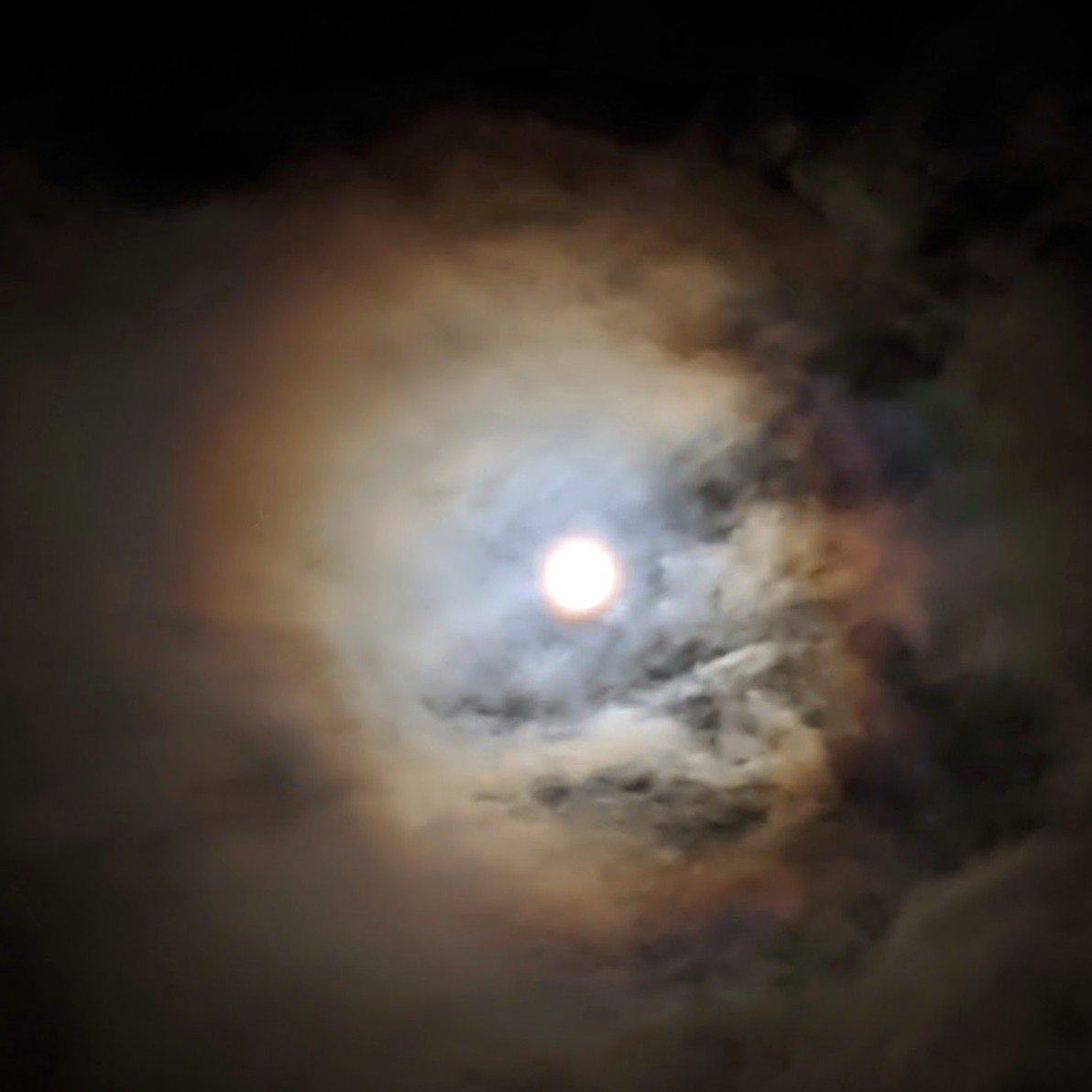 Enhanced photo of the moon with a cloud driven halo