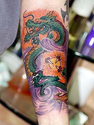 Dragon Tattoos On The Arm. dragon tattoos men arm. dragon