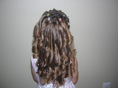 flower girl hairstyle Here's howStart by parting out a section in 