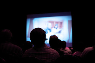 Friends and Family Enjoying Home Theater Movie Night