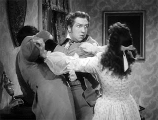 Still - Hepzibah (Margaret Lindsay) prevents Clifford (Vincent Price) from strangling his brother. House of the Seven Gables (1940).