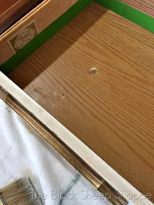 Surface damage to drawer interior.