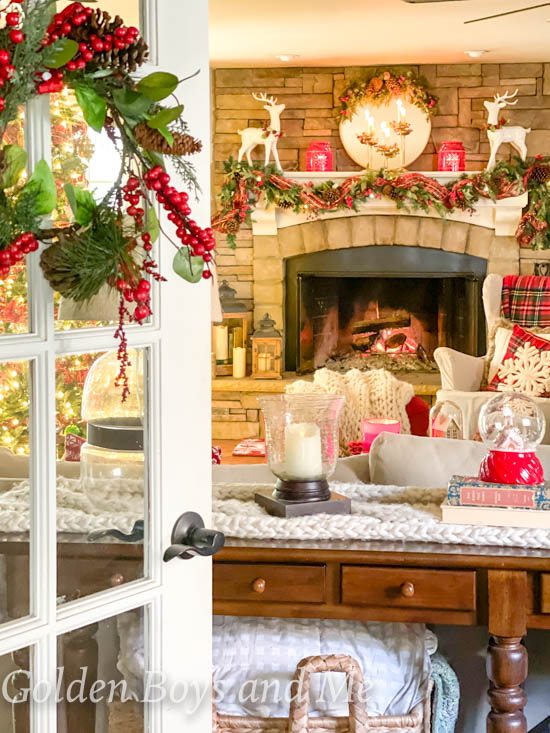 Classic  Christmas decor in family room with stone fireplace - www.goldenboysandme.com