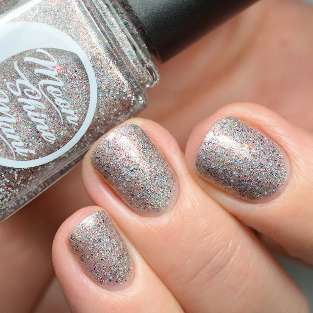 grey holographic nail polish with glitter swatch