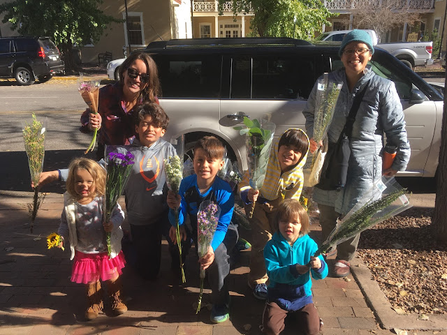 Giving out free flowers in Santa Fe Plaza