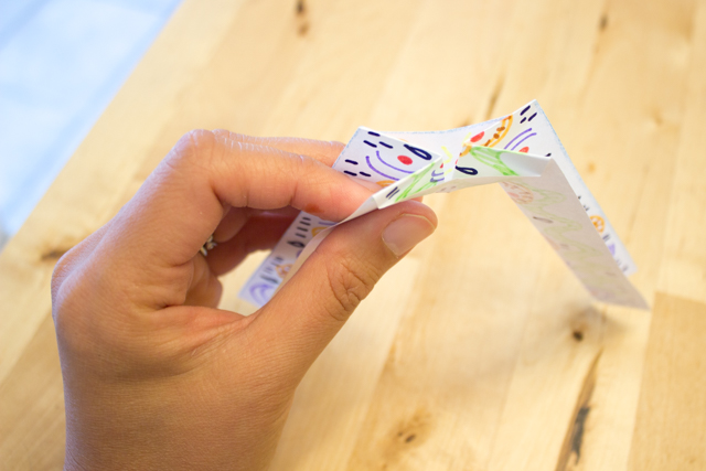 easy instructions showing how to fold balancing origami for kids