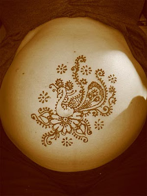 The Peacock henna design on pregnant belly picture is courtesy of