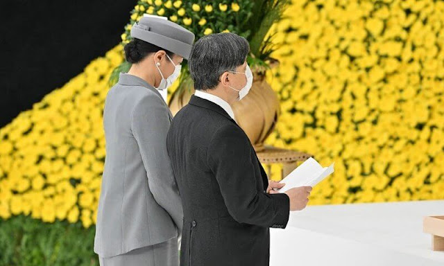 Emperor Naruhito and Empress Masako offer a moment of silence to the war dead during a memorial ceremony