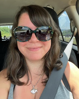 Ellen Hamilton Latzen clicking a selfie while sitting inside the car