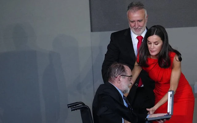 Queen Letizia wore a red orange gathered midi dress made of wool blend fabric by ZARA x Narciso Rodriguez