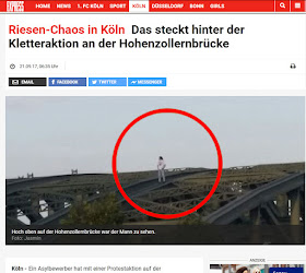 http://www.express.de/koeln/riesen-chaos-in-koeln-das-steckt-hinter-der-kletteraktion-an-der-hohenzollernbruecke-28446920?originalReferrer=