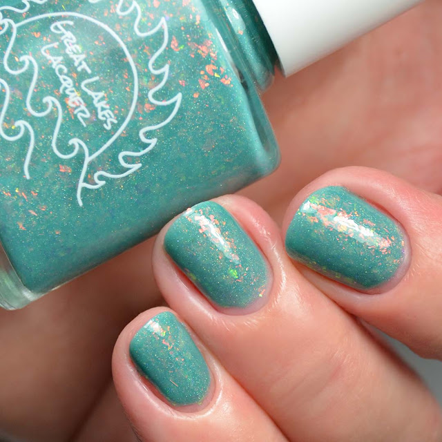 teal nail polish with flakies swatch