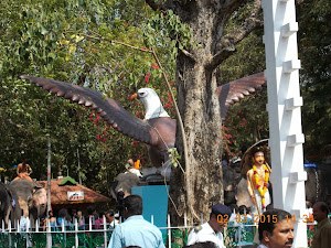 "MANJULA BANYAN TREE WITH GARUDA STATUE".