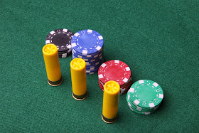 Poker chips with shotgun shells.