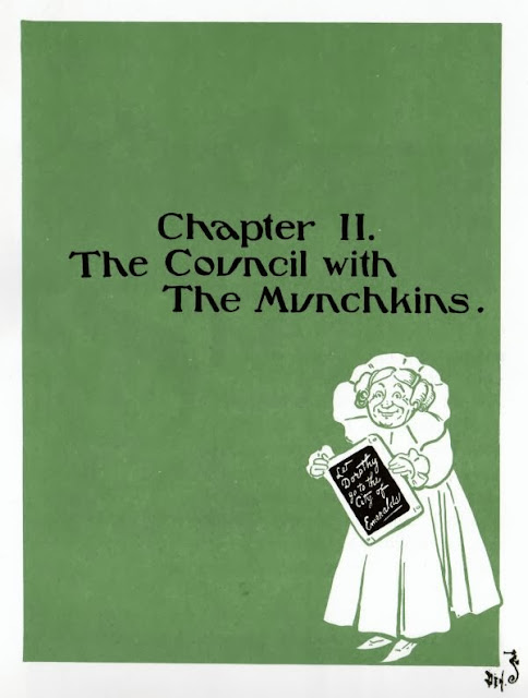 The Good Witch of the North holds her slate on the title page for "Chapter II. The Council with The Munchkins."