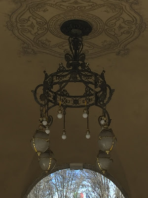 Light fixture under the portici near Balzer Pasticceria