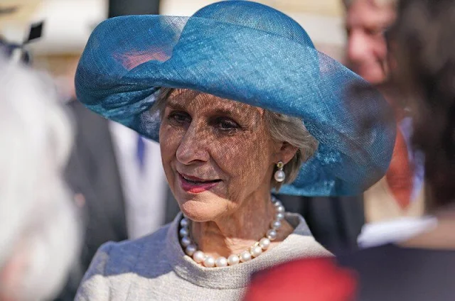 Duchess of Edinburgh wore a salmon pink wrap dress by Suzannah. Princess Anne floral print dress, Duchess of Gloucester gray dress