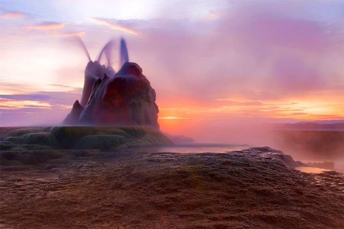 Fly Geyser is a little-known tourist attraction, even to Nevada residents. It is located near the edge of Fly Reservoir and is only about 5 feet (1.5 m) high, (12 feet (3.7 m) counting the mound on which it sits). The Geyser is not an entirely natural phenomenon, and was accidentally created in 1916 during well drilling. The well functioned normally for several decades, but in the 1960s geothermally heated water found a weak spot in the wall and began escaping to the surface. Dissolved minerals started rising and accumulating, creating the mount on which the geyser sits, which continues growing. Today water is constantly spewing, reaching 5 feet (1.5 m) in the air. The geyser contains several terraces discharging water into 30 to 40 pools over an area of 30 hectares (74 acres). The geyser is made up of a series of different minerals, which gives it its magnificent coloration.