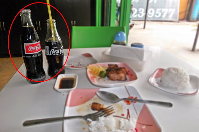 two different size Coke bottles both labeled 237ml