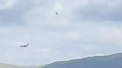 Diamond shape UFO flies next to a military jet sept 2022.