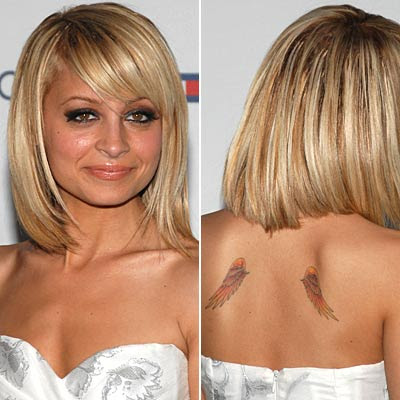 small angel wings tattoo combinated whit heart and tattoo script on chest