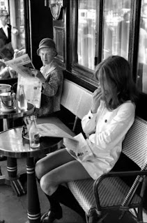 photograph of two women in a paris cafe terrace by henri cartier-bresson