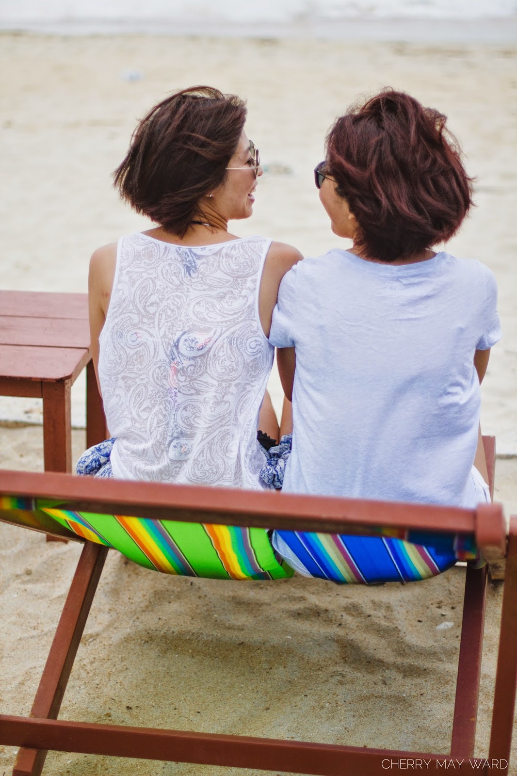 happy couple sitting on chairs on the beach, beach chairs on Koh Samui, Cherry May Ward Photography, Koh Samui Professional Photographer