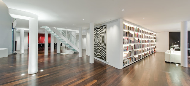 Picture of the London penthouse interiors showing the space between the library and dining room