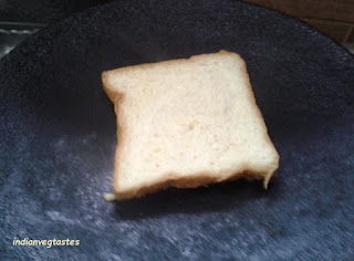 Place the bread slice on tawa