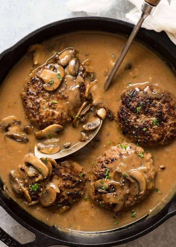 Recipe VIDEO above. Salisbury steak is a totally scrumptious way to transform the humble ground beef / mince into something amazing! The onion grating / soaking breadcrumbs will make your patties extra tasty and tender, and the Mushroom Gravy is made extra delicious by cooking the Salisbury Steaks IN the gravy