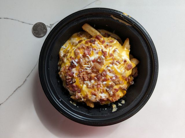 Top-down view of KFC's Smash'd Potato Bowl.